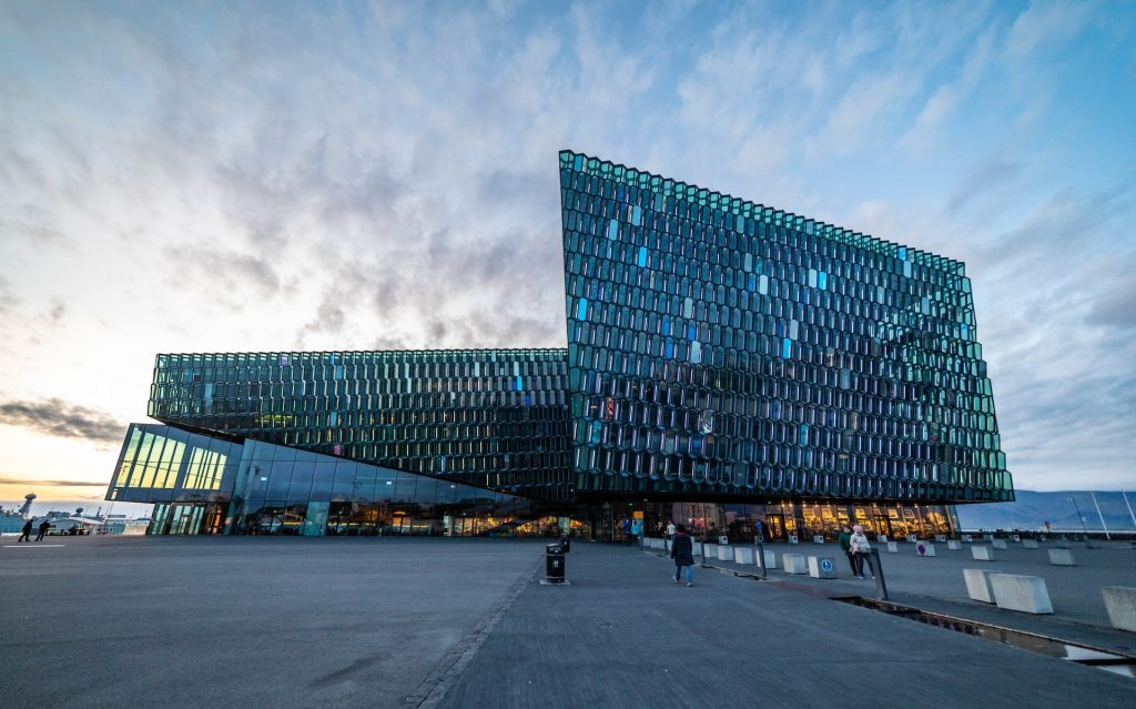 you should visit the Harpa concert hall when you arrive in Reykjavik iceland