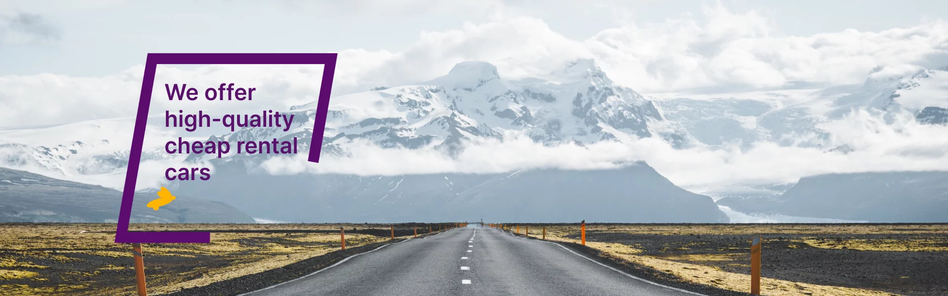 Empty road leading towards snow-capped mountains in Iceland