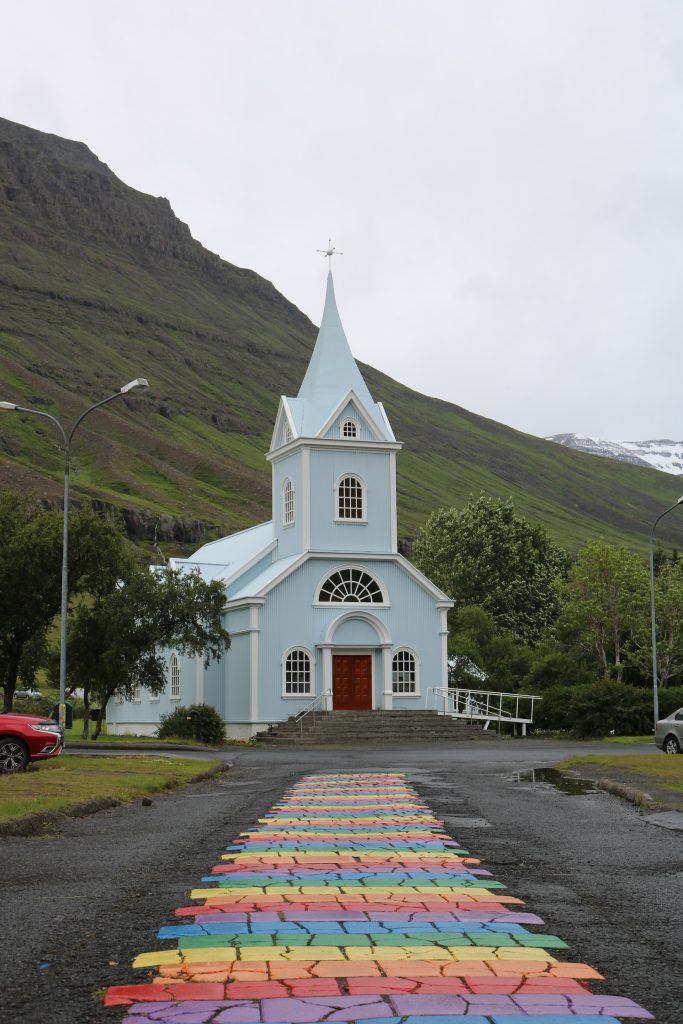 The iconic blue church with rainbow path is inside the Seydisfjordur town