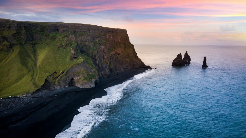 How were Iceland’s black sand beaches created?